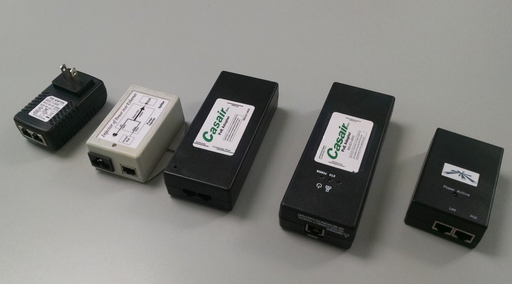 An assortment of Casair Power over Ethernet (POE) Adapters